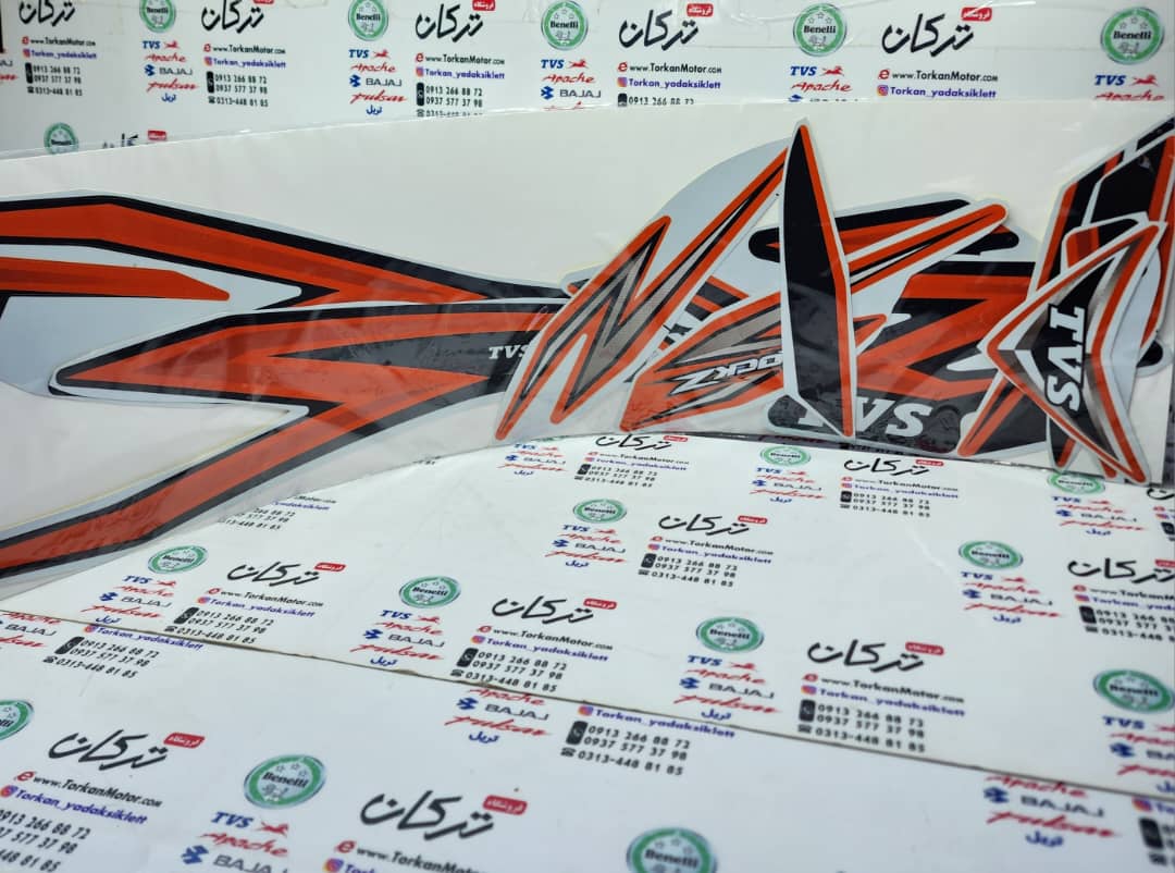 WhatsApp Image 2023-02-09 at 13.11.41 (3) ارم ( برچسب ) کامل موتور TVS راکس انژکتور مشکی نارنجی - Image 1
